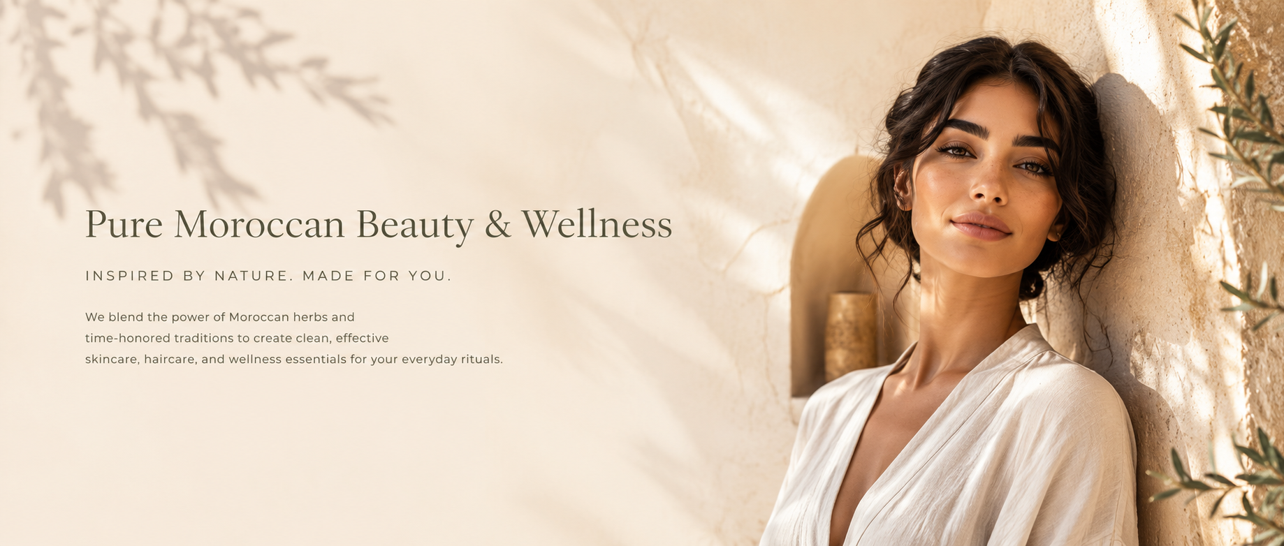 Woman in a white robe leaning against a textured wall with text about Pure Moroccan Beauty & Wellness.