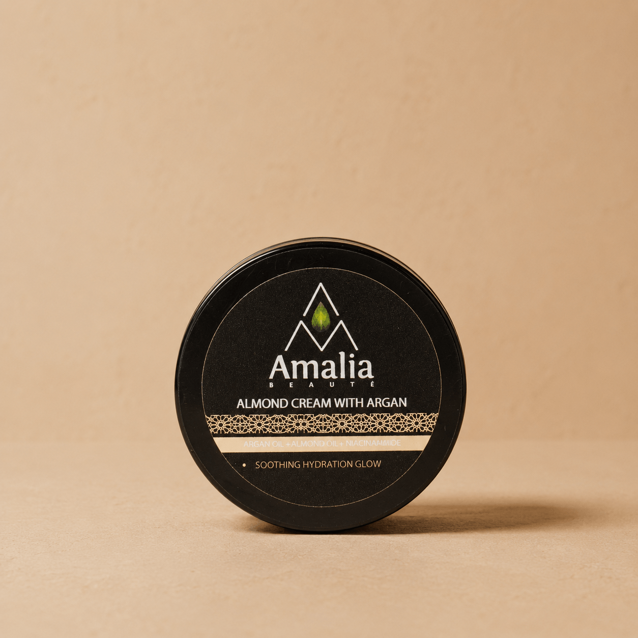 Amalia Beauty almond cream with argan container on a beige background