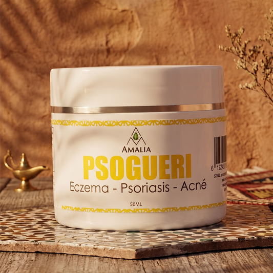 Jar of Psogueri cream on a wooden surface with a warm background